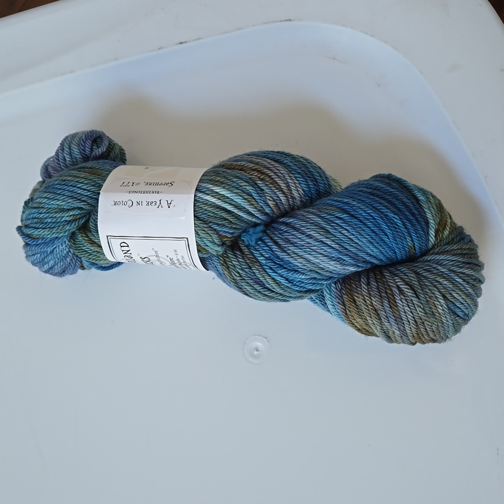 1 skein of Wonderland Yarns March Hare yarn in blue
